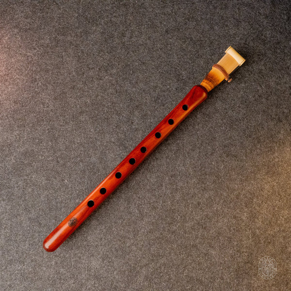 1. Duduk in A by Dudukhouse – full-length apricot wood duduk laid diagonally on Dudukhouse's textured grey backdrop